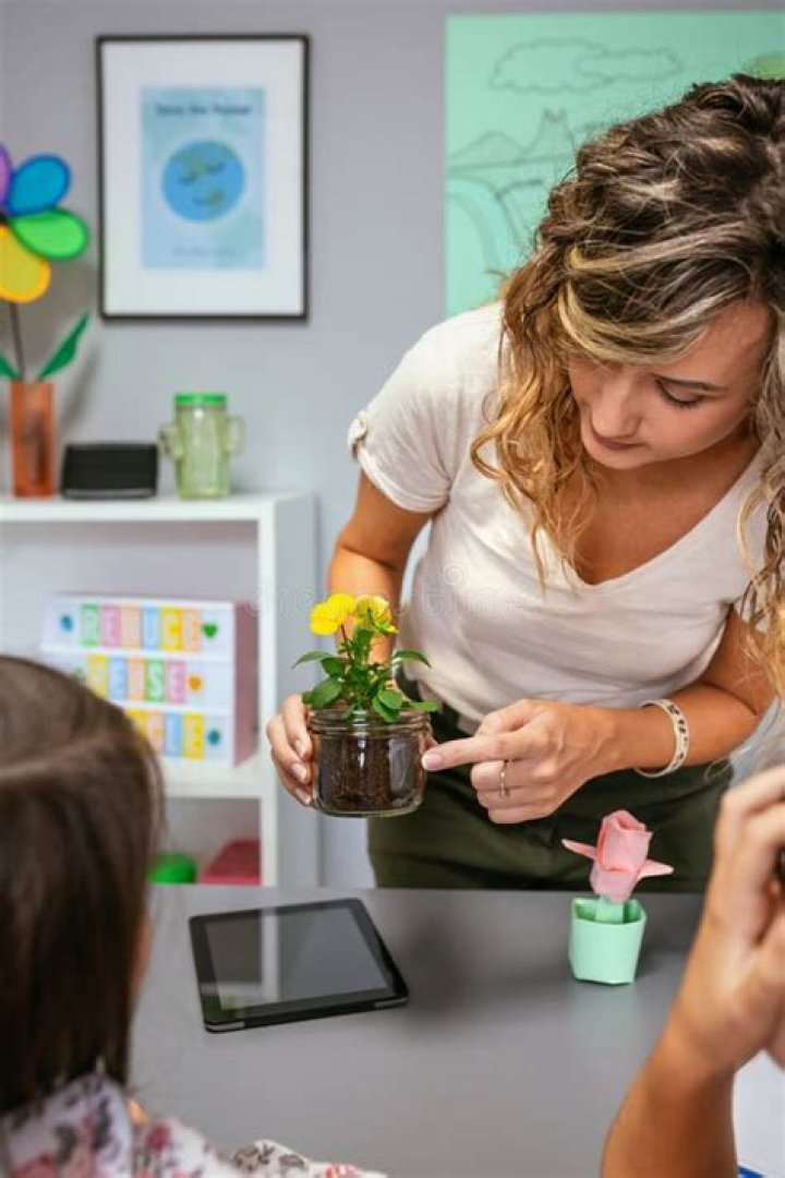 Teacher with plant 